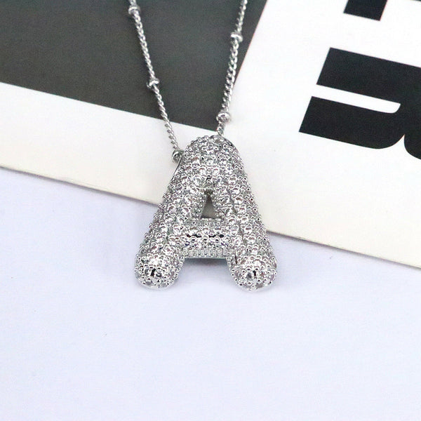 Collier avec pendentif lettre en cuivre et zircon incrusté
